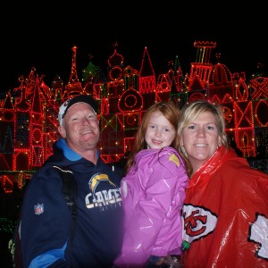 Princess Jacquelyn B. with her family in front of It's a Small World