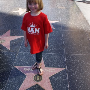 Princess Zoe A. standing on Ryan Seacrest's Star