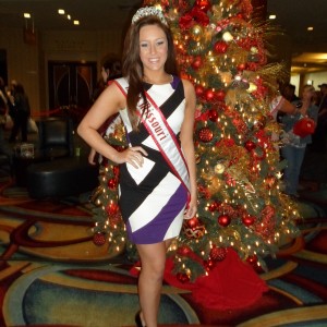 Miss Missouri Teen posing in front of a Christmas Tree