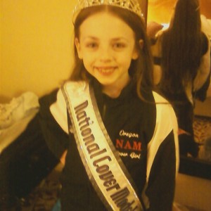 Isabella Conner in her new Oregon NAM royalty jacket with new Cover Model crown and banner on at nationals.