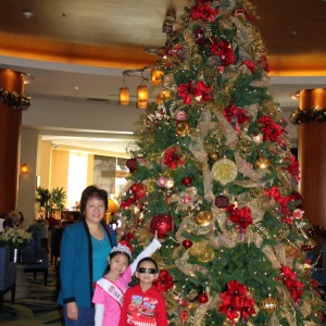 Posing with the Family in front of the Christmas Tree