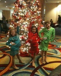 Princess Team Leadership posing in front of the Christmas Tree