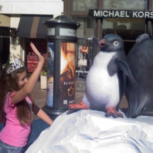 High fiving with Happy Feet Penguins at The Grove