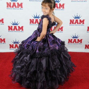 Miss Arizona Gabriela Bustillos on the NAM backdrop for formal wear.