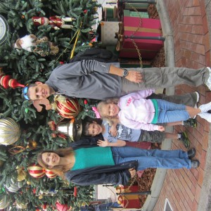 Princess Cori and her family taking a photo opp at Disney
