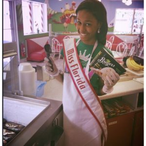 Miss Florida Jr. Teen, Mayalisa Cousins, serves ice cream through Give Kids The World organization