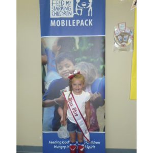 NAM Miss Ohio Princess, Kamryn O'Leary, volunteers at Feed My Starving Children