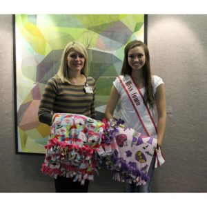 National American Miss Iowa Jr. Teen Queen, Hannah Bockhaus, makes fleece blankets for pediatric cancer patients